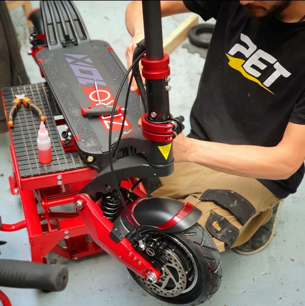 Nikos Repairing an Electric Scooter at Personal Electric Transport Repair Centre